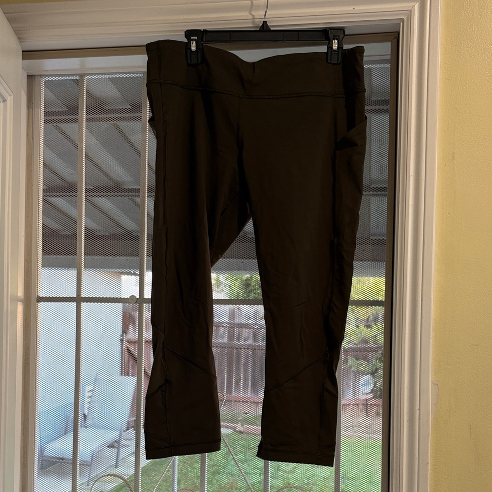 Lululemon Olive Leggings with mesh outline in back lower leg size 12